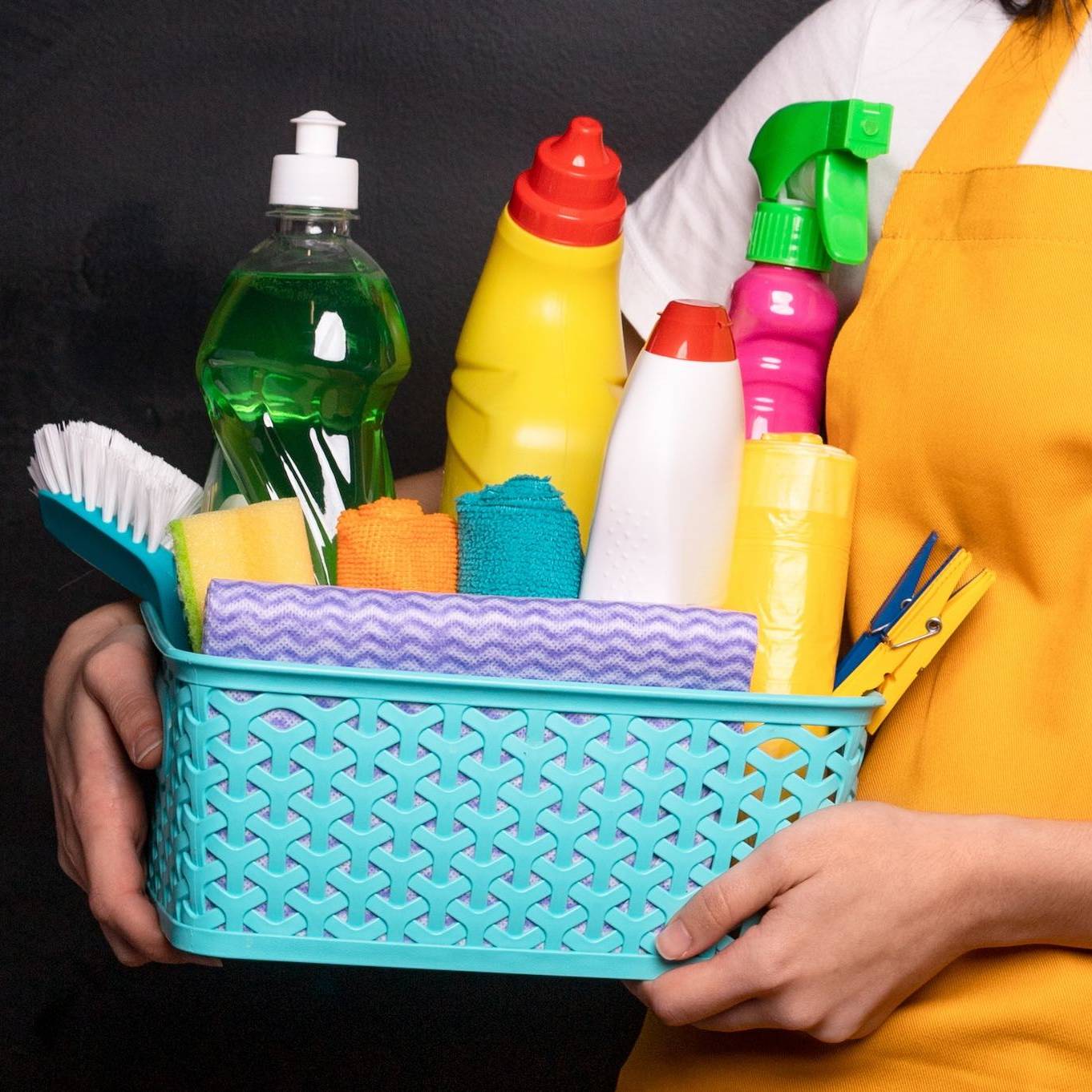Happy Young Maid With Detergents